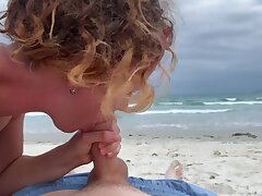 Deep blowjob on the beach, woman in bikini inhaling cock, cum mouth outdoors